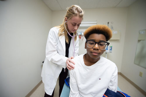 image of patient Isaiah getting examined